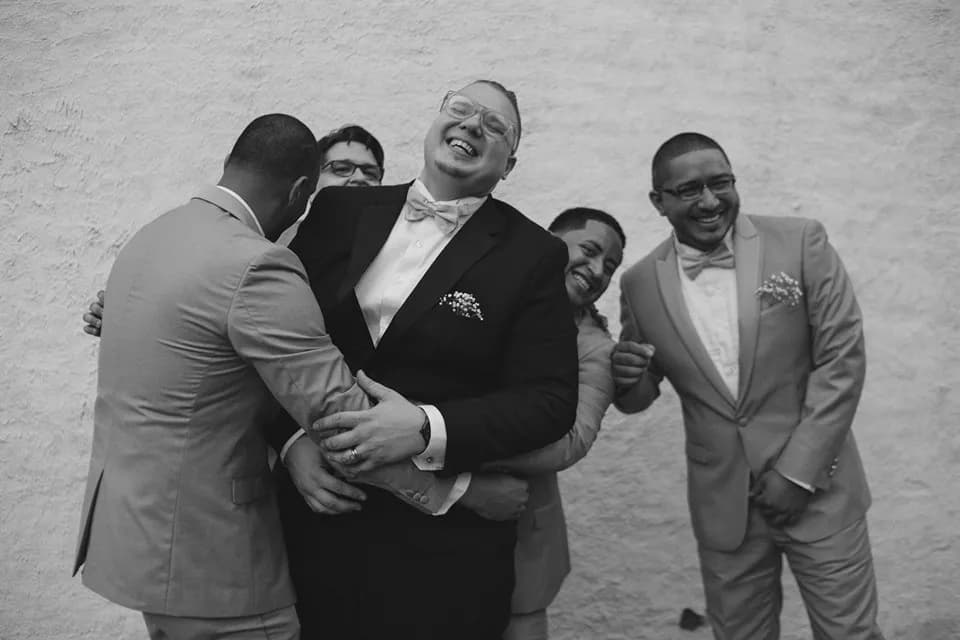 Guests laughing and taking photos together